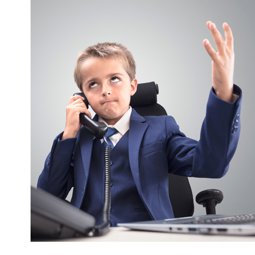 Child dressed in business suit, looking frustrated